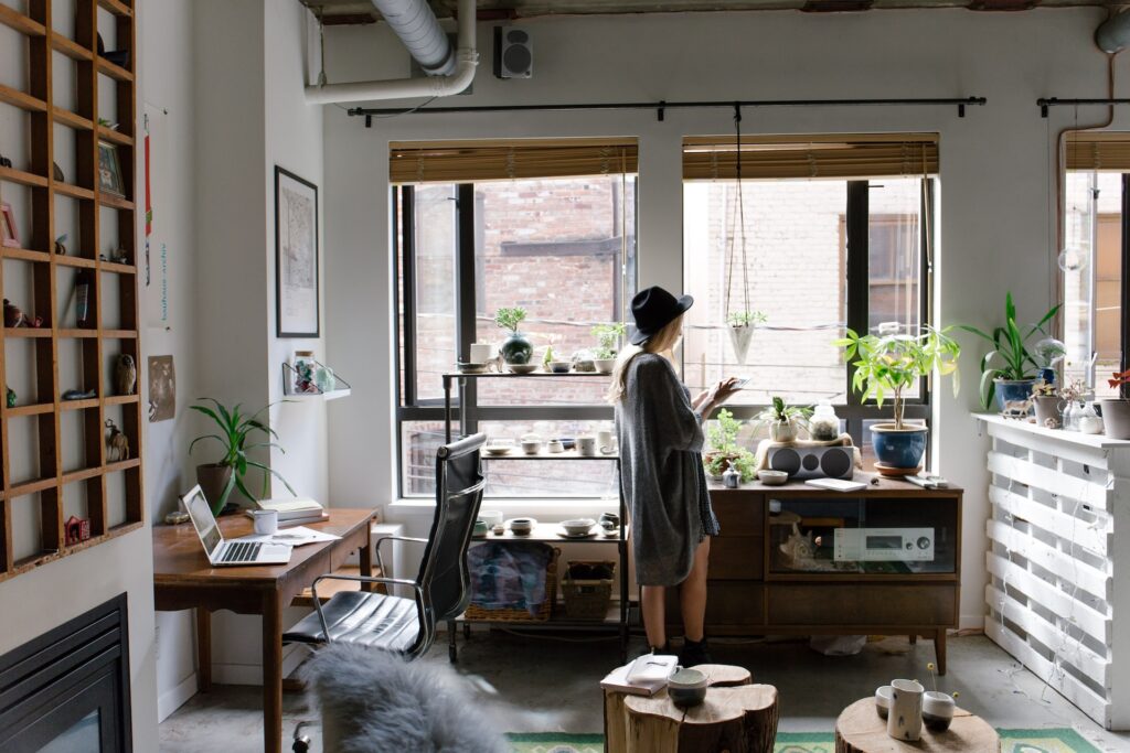 A renter in their new apartment they found thanks to the useful tips for first-time renters in Manhattan.
